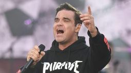 altText(Robbie Williams formará una banda a 25 años de su salida de Take That)}